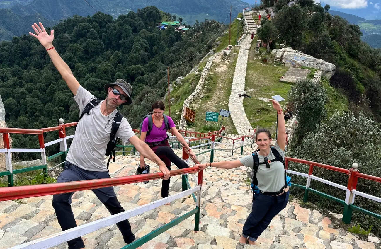 Participants practicing yoga amidst Himalayan peaks in Rishikesh retreat