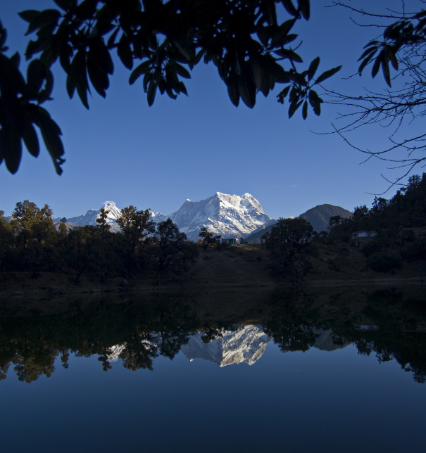 Deoria Tal lake with mirror reflection of Chaukhamba peaks in Uttarakhand