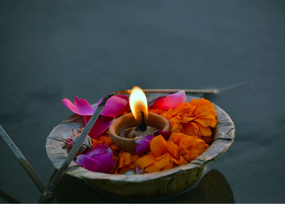 Floating diyas on Ganga River during Ganga Aarti at Triveni Ghat