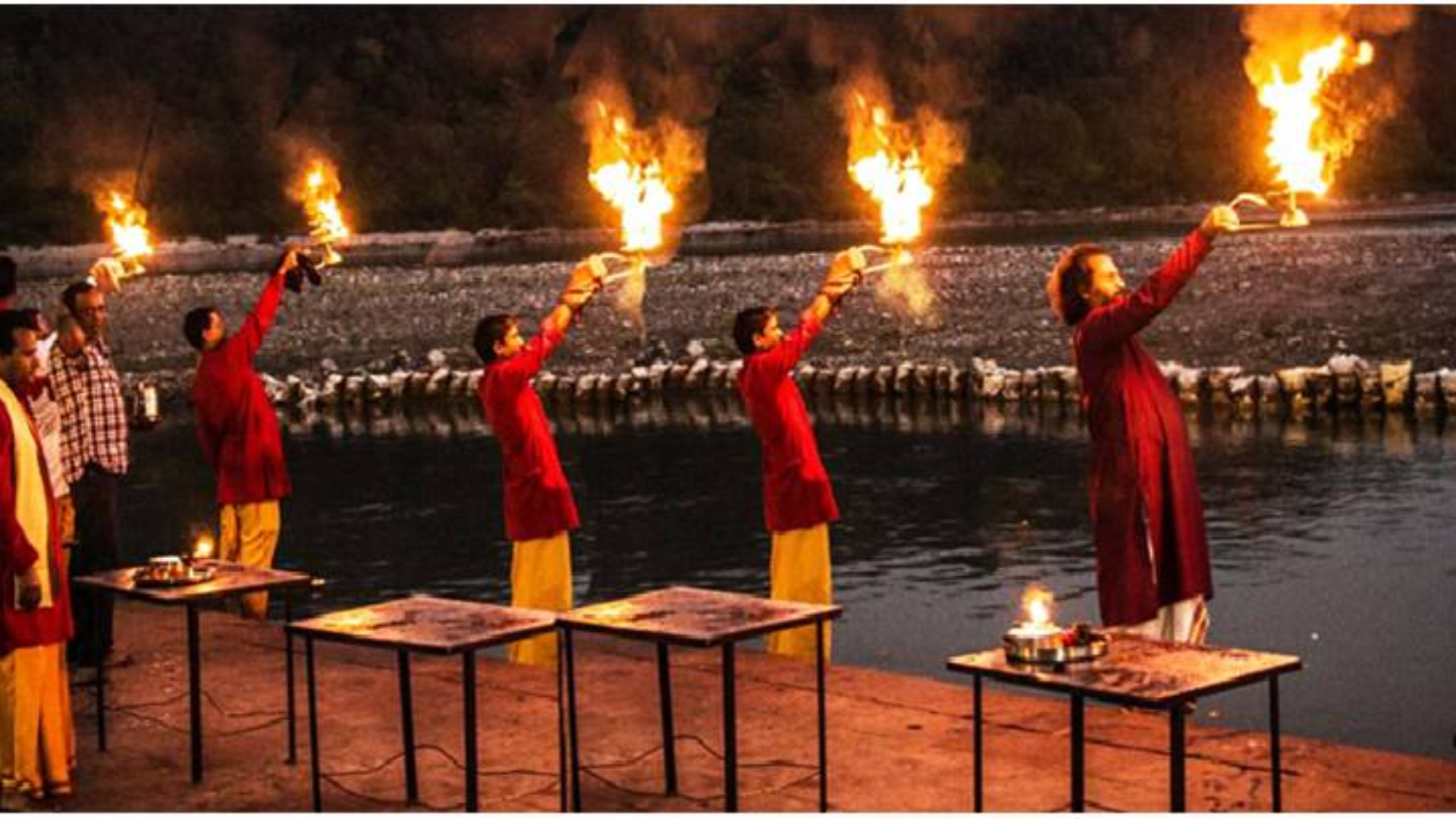Lamps reflecting on River Ganga during Ganga Aarti at Triveni Ghat