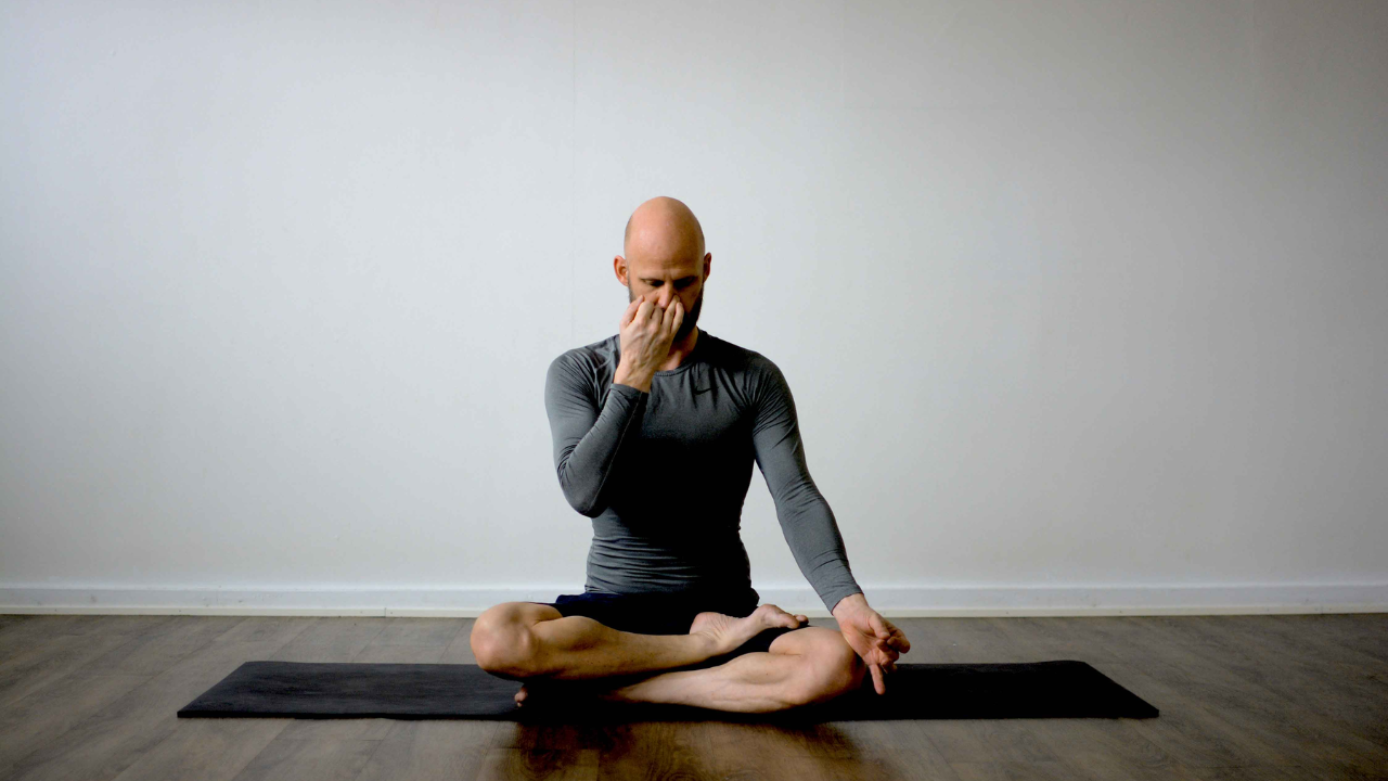 Person practicing pranayama breathing techniques for full body detox at home