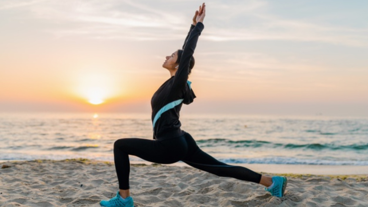 Woman doing surya namaskar sun salutation for weight loss